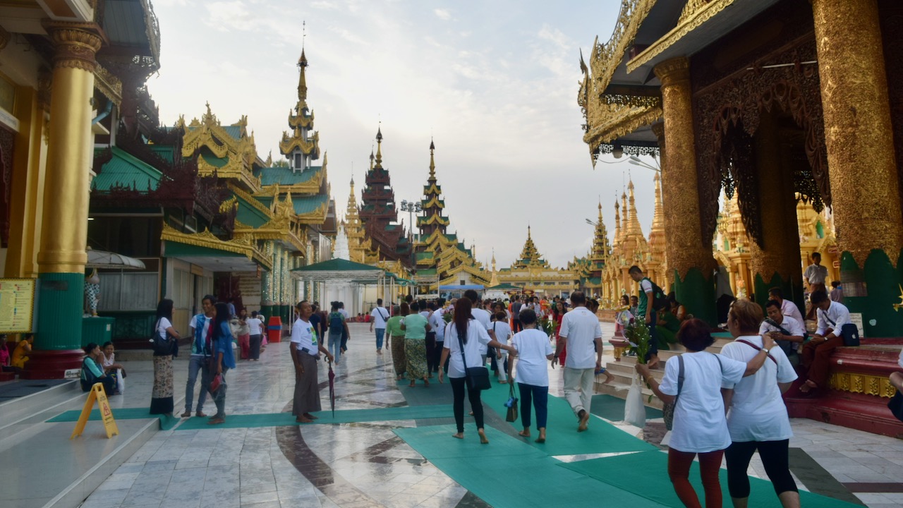 People are circumnavigating the Shwedagon Pagoda