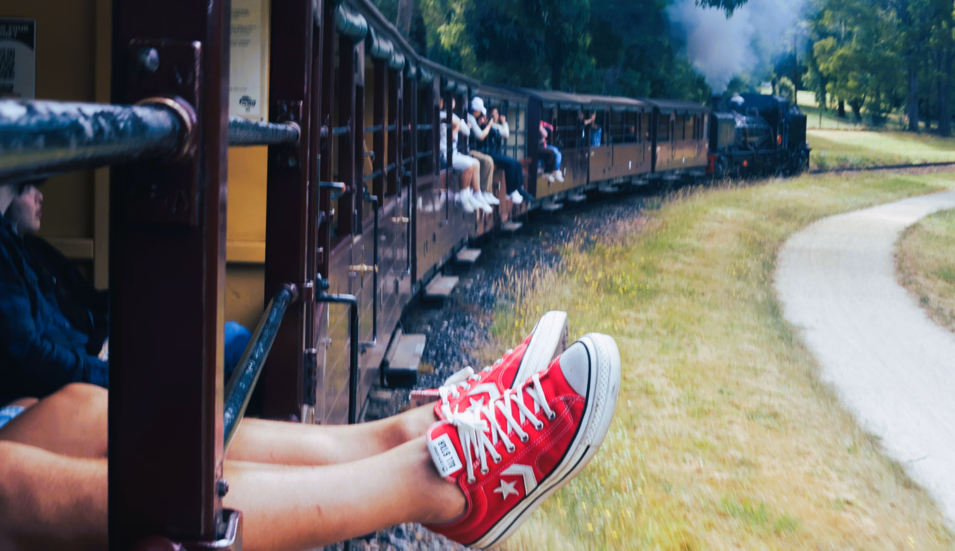 puffing billy legs dangling open carriage dandenong ranges melbourne