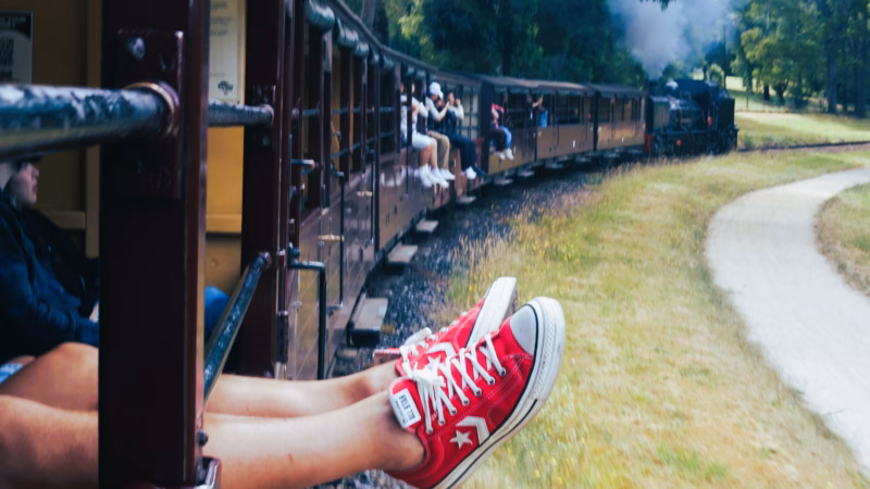 puffing billy legs dangling open carriage dandenong ranges melbourne
