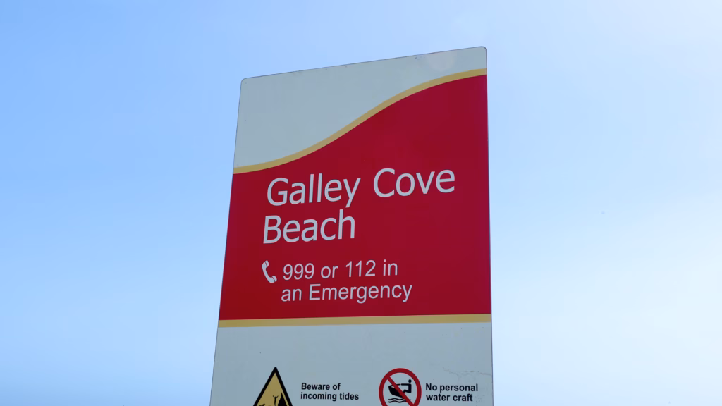 Galley Cove Beach sign against a clear blue sky