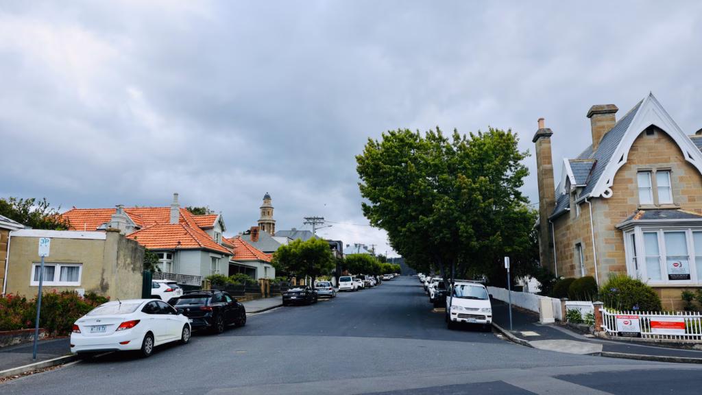 Battery Point residential street with the stepped octagonal tower of St George's Anglican Church visible in the distance