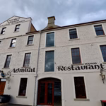 Drunken Admiral seafood restaurant facade with hand-painted signage on Hobart's old wharf