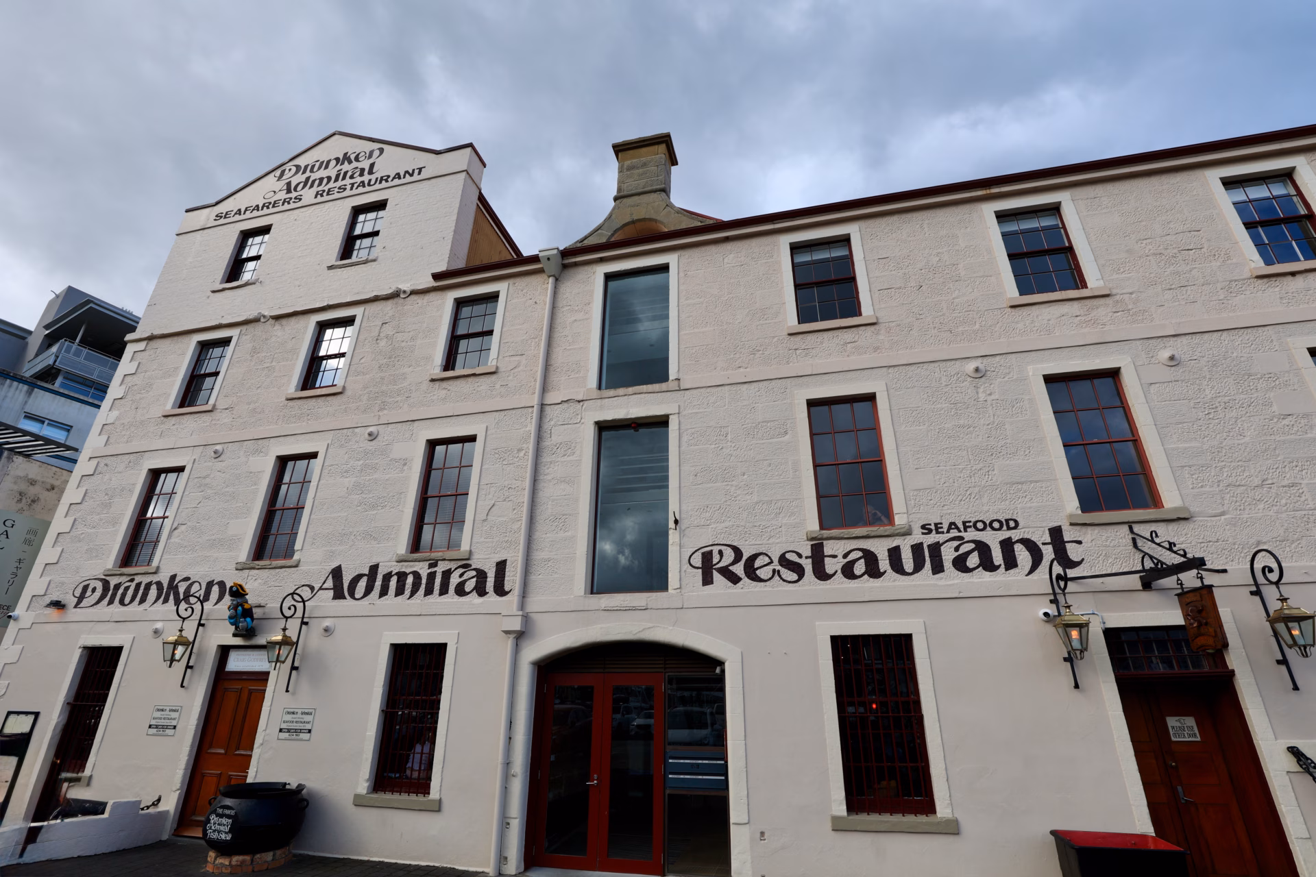 Drunken Admiral seafood restaurant facade with hand-painted signage on Hobart's old wharf