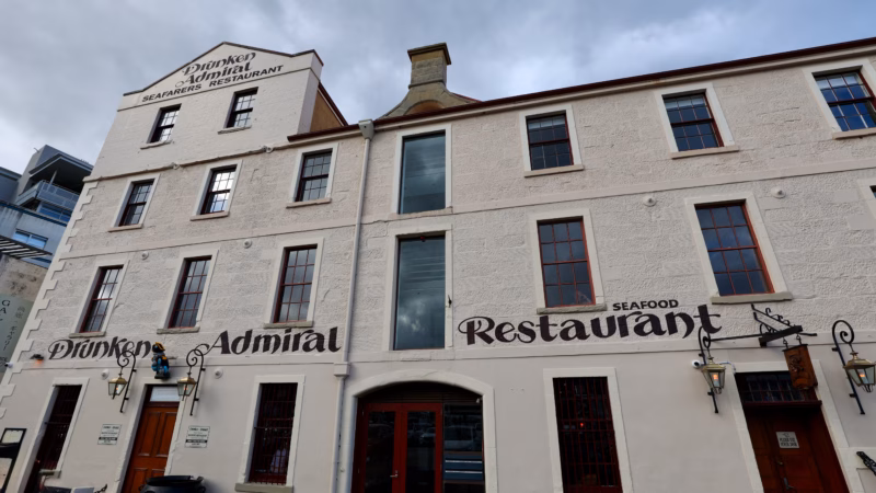 Drunken Admiral seafood restaurant facade with hand-painted signage on Hobart's old wharf