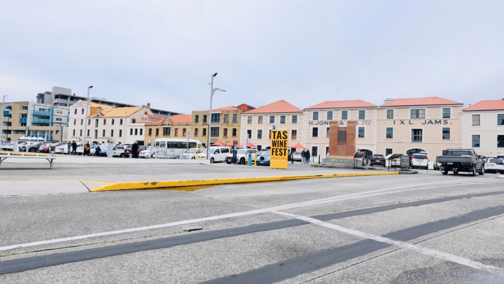 Wide view of the IXL Jam Factory and Henry Jones precinct on Hunter Street, Hobart, with Tasmanian Wine Festival signage