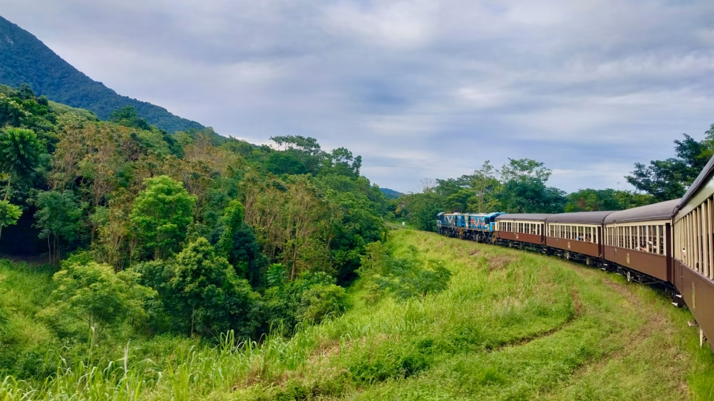 Kuranda Scenic Railway train curving with locomotive visible on descent