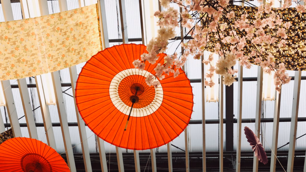 Paper umbrella and cherry blossom decorations in Osu