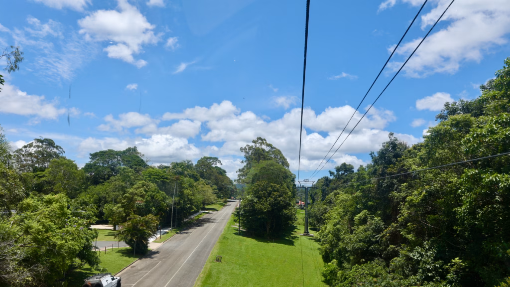 Skyrail cable line over suburban street approaching Kuranda terminal
