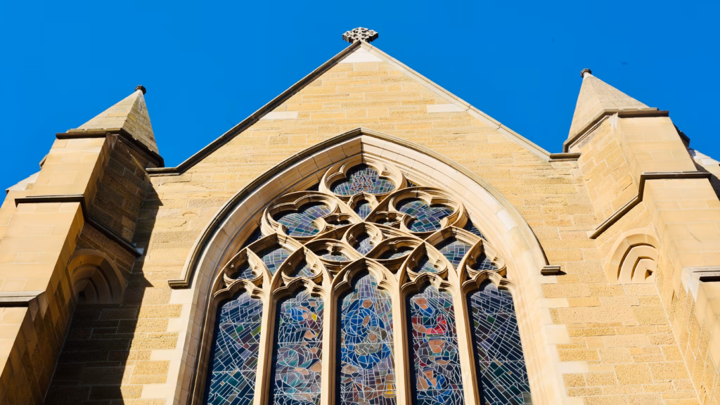 St David's Cathedral Hobart, Gothic Revival sandstone facade with stained glass rose window
