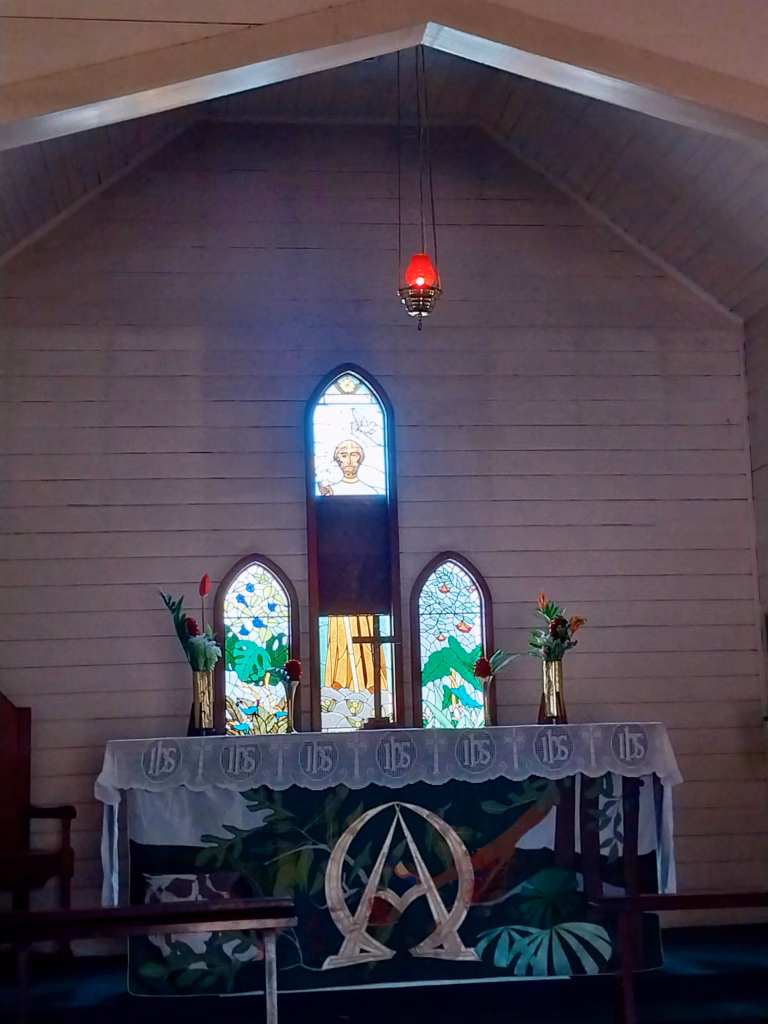 Interior of St Saviour's Anglican Church Kuranda with tropical stained glass