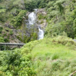 Stoney Creek Falls beside Kuranda Scenic Railway trestle bridge