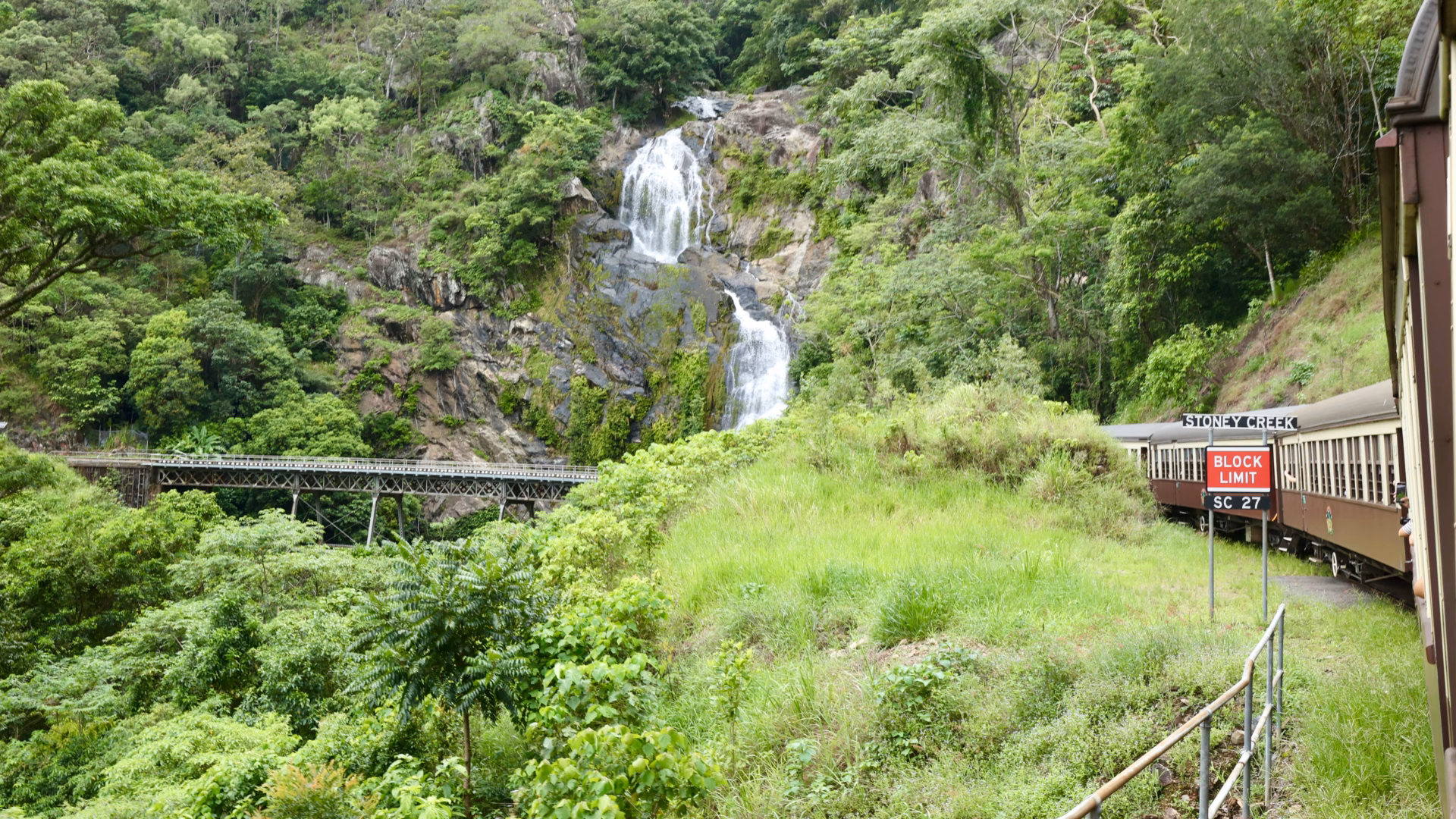 Stoney Creek Falls beside Kuranda Scenic Railway trestle bridge