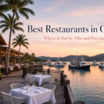 Waterfront restaurant dining at sunset in Cairns, tables overlooking the marina