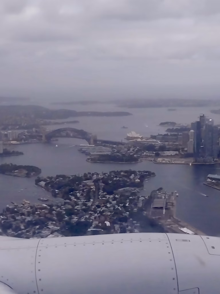 Sydney CBD skyscrapers seen from the aircraft window during final descent