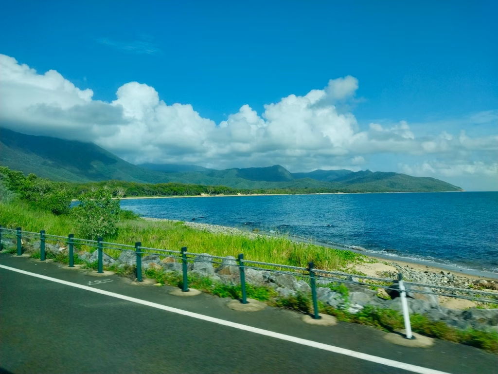 Coastal view along the Captain Cook Highway near Rex Lookout, taken from the tour bus