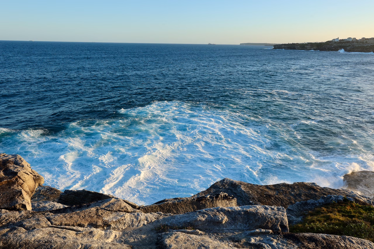 Whitewater breaking below sandstone cliffs at Marks Park on the Bondi to Coogee walk